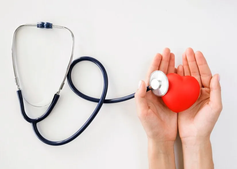 flat-lay-hands-holding-heart-shape-with-stethoscope_23-2148635205